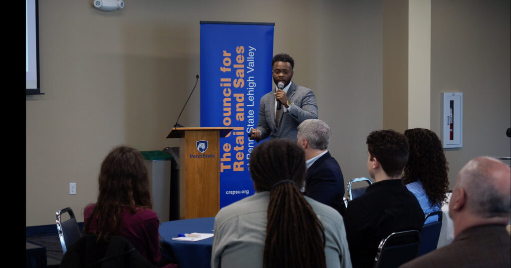 Man speaking to audience.